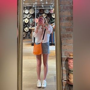 No brand - orange crossbody bag with a navy and white adjustable strap!